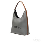 Chanel Deauville Canvas Tote Bag with Brown Leather